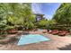 Relax by this refreshing outdoor pool surrounded by lush greenery and lounge chairs at 7151 E Rancho Vista Dr # 3001, Scottsdale, AZ 85251