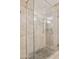 Modern tiled shower with glass enclosure and updated fixtures at 7151 E Rancho Vista Dr # 3001, Scottsdale, AZ 85251