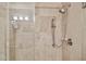 Detailed view of modern shower fixtures and tiled walls inside glass shower at 7151 E Rancho Vista Dr # 3001, Scottsdale, AZ 85251