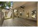 Outdoor patio with ceiling fan, artificial grass and decorative pavers at 7240 N Dreamy Draw Dr # 109, Phoenix, AZ 85020