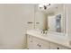 Well-lit powder room featuring a sleek vanity, neutral color palette, and stylish hardware at 7240 N Dreamy Draw Dr # 109, Phoenix, AZ 85020