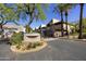 Community entrance with lush landscaping and signage at 7240 N Dreamy Draw Dr # 109, Phoenix, AZ 85020