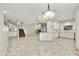 Bright open-concept layout with living room, kitchen, and staircase featuring tiled flooring at 7240 N Dreamy Draw Dr # 109, Phoenix, AZ 85020