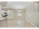 Bright living space featuring tiled floors, granite breakfast bar, and stainless-steel appliances at 7240 N Dreamy Draw Dr # 109, Phoenix, AZ 85020