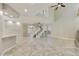 Spacious living room with staircase, neutral walls, and tiled floors at 7240 N Dreamy Draw Dr # 109, Phoenix, AZ 85020