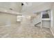 Open-concept living space with high ceilings, staircase, and an abundance of natural light at 7240 N Dreamy Draw Dr # 109, Phoenix, AZ 85020