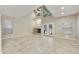 Bright living room with fireplace, vaulted ceilings, and French doors opening to backyard at 7240 N Dreamy Draw Dr # 109, Phoenix, AZ 85020