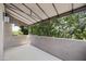 Covered patio offering an outdoor living space surrounded by mature trees at 7240 N Dreamy Draw Dr # 109, Phoenix, AZ 85020