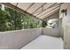 Large outdoor patio with partial shade and lush tree view at 7240 N Dreamy Draw Dr # 109, Phoenix, AZ 85020