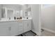Bright bathroom showcases double vanity, mirrors, and a tiled shower at 820 N 8Th Ave # 25, Phoenix, AZ 85007