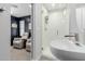 Modern bathroom features a glass walk-in shower, white vessel sink, and tile floor at 820 N 8Th Ave # 25, Phoenix, AZ 85007