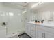 Light and bright bathroom features glass enclosed shower and double vanity at 820 N 8Th Ave # 25, Phoenix, AZ 85007