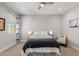 Neutral bedroom features a queen size bed, 2 windows, and ceiling fan at 820 N 8Th Ave # 25, Phoenix, AZ 85007