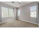 Light and airy bedroom with three windows and modern ceiling fan at 820 N 8Th Ave # 25, Phoenix, AZ 85007