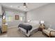 Neutral bedroom features an end table, ceiling fan and comfortable chair at 820 N 8Th Ave # 25, Phoenix, AZ 85007