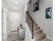 Hallway with carpeted stairs, metal banister, modern decor, and grey storage cabinet at 820 N 8Th Ave # 25, Phoenix, AZ 85007