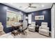 Comfortable home office with a large window, desk, swivel chair, and seating area with recliner chairs at 820 N 8Th Ave # 25, Phoenix, AZ 85007