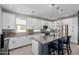 A kitchen features white cabinets, a gray countertop, and stainless appliances at 820 N 8Th Ave # 25, Phoenix, AZ 85007