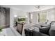 Living area with gray tile, sectional sofa, and patio access at 820 N 8Th Ave # 25, Phoenix, AZ 85007