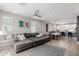 Open concept living room with large sectional couch, tile flooring, and dining area with bright natural light at 820 N 8Th Ave # 25, Phoenix, AZ 85007
