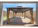 Comfortable backyard patio under a covered metal pergola at 8872 W Hollywood Ave, Peoria, AZ 85345