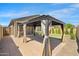 Beautiful backyard with lush landscaping and covered patio area at 8872 W Hollywood Ave, Peoria, AZ 85345