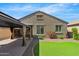 Beautiful backyard featuring artificial turf and covered patio at 8872 W Hollywood Ave, Peoria, AZ 85345