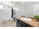 This bathroom features a shower/tub combination, a vanity with storage, and tiled flooring at 8872 W Hollywood Ave, Peoria, AZ 85345