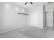 Neutral bedroom featuring carpet, modern ceiling fan, and closet at 8872 W Hollywood Ave, Peoria, AZ 85345