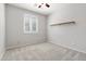 This bedroom offers natural light from a window with plantation shutters at 8872 W Hollywood Ave, Peoria, AZ 85345