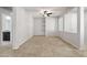 Open-concept flex room with tile floors, neutral paint, shelving, and a ceiling fan at 8872 W Hollywood Ave, Peoria, AZ 85345