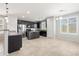 Well-lit kitchen with stainless steel appliances, dark cabinetry, and a spacious center island at 8872 W Hollywood Ave, Peoria, AZ 85345