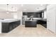 Spacious kitchen with stainless steel appliances, ample dark cabinetry, and a granite-topped center island at 8872 W Hollywood Ave, Peoria, AZ 85345