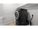 Modern laundry room featuring front loading washer and dryer at 8872 W Hollywood Ave, Peoria, AZ 85345