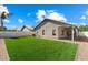 Green backyard with privacy fence and patio at 9143 W Kings Ave, Peoria, AZ 85382