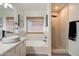 A modern bathroom with a soaking tub, walk-in shower, sleek fixtures, and a stylish vanity at 9143 W Kings Ave, Peoria, AZ 85382