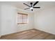 Bright, airy bedroom featuring neutral paint, natural light, and a modern ceiling fan at 9143 W Kings Ave, Peoria, AZ 85382