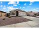 Charming single-story home with a well-maintained front yard and neutral-toned exterior at 9143 W Kings Ave, Peoria, AZ 85382