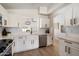 Bright kitchen featuring white cabinets, stainless steel appliances, farmhouse sink, and ample counter space at 9143 W Kings Ave, Peoria, AZ 85382