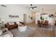 Inviting living room with stylish furniture, open layout, and a view to the dining area at 9143 W Kings Ave, Peoria, AZ 85382