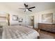 Modern main bedroom featuring a plush bed, neutral decor, and an ensuite bathroom view at 9143 W Kings Ave, Peoria, AZ 85382