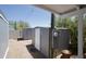 Backyard featuring gravel, storage sheds, and block wall, providing a functional outdoor space at 9733 E Baywood Ave, Mesa, AZ 85208