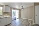 Inviting dining area features sliding glass doors to the patio and new wood flooring at 9733 E Baywood Ave, Mesa, AZ 85208