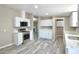 Bright kitchen featuring white cabinets, stainless steel appliances, and modern countertops at 9733 E Baywood Ave, Mesa, AZ 85208