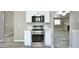 Close-up of kitchen features a stainless steel stove, oven and light countertops at 9733 E Baywood Ave, Mesa, AZ 85208