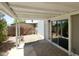 Covered patio with sliding glass door allows for seamless indoor-outdoor living and access to backyard at 9733 E Baywood Ave, Mesa, AZ 85208