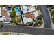 Aerial view of property showcasing private pool, solar panels, and lush landscaping at 1023 E Sahuaro Dr, Phoenix, AZ 85020