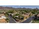 Aerial view of homes in community, featuring palm trees and mountain views at 1023 E Sahuaro Dr, Phoenix, AZ 85020