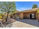 Beautiful backyard with seating, desert landscaping and covered patio at 1023 E Sahuaro Dr, Phoenix, AZ 85020