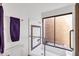 Walk-in shower in bathroom with decorative tile at 1023 E Sahuaro Dr, Phoenix, AZ 85020